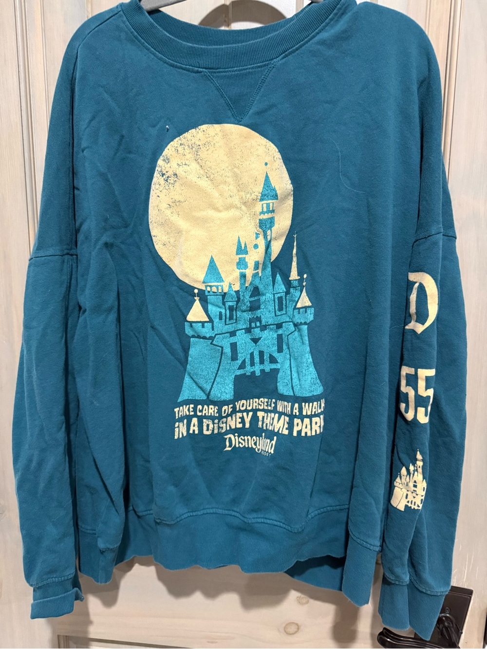 Disney Teal Pullover with Castle Graphic and Yellow Accent